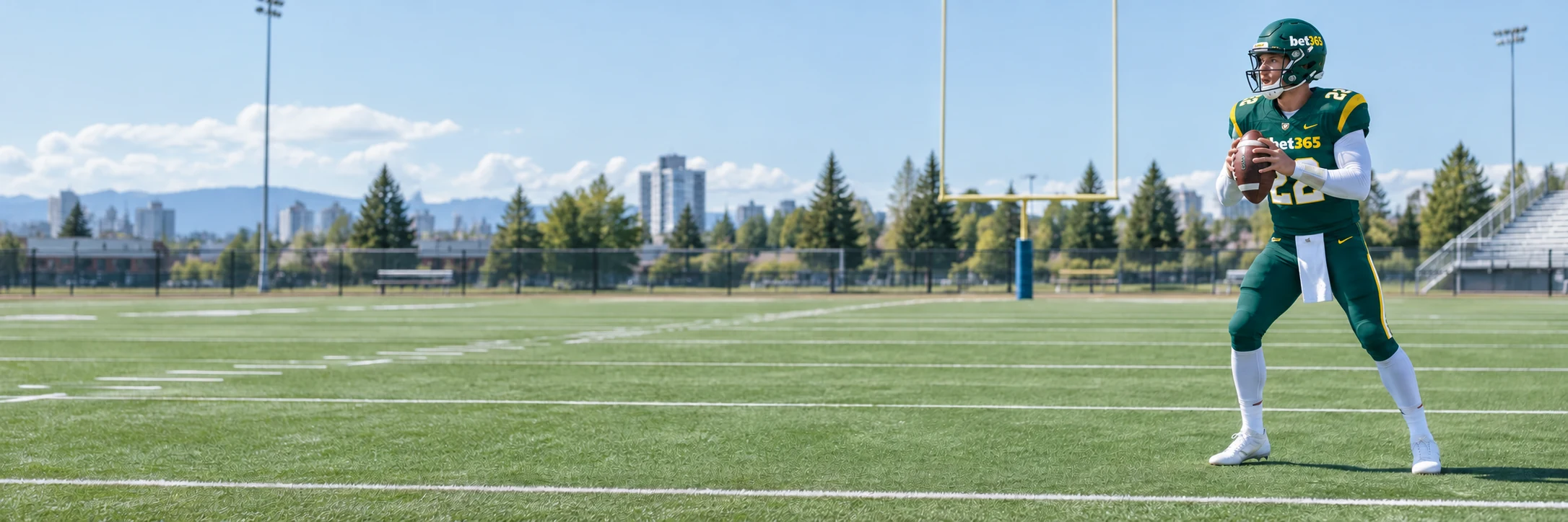 Adult football quarterback in a green and yellow bet365 uniform on a Canadian football field